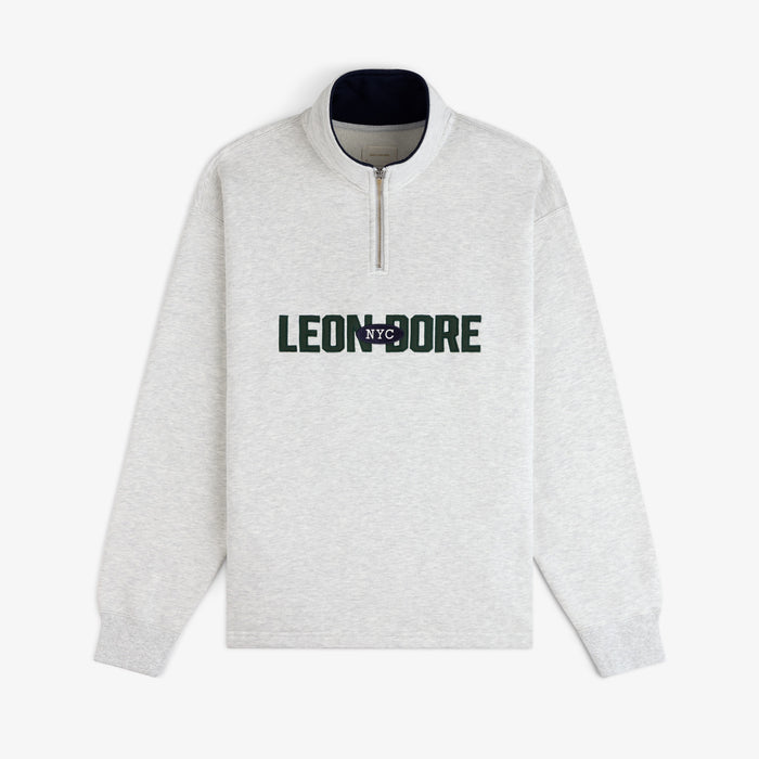 Light gray Aimé Souvenir Quarter Zip with LEON DORE NYC in green and navy text on the front.