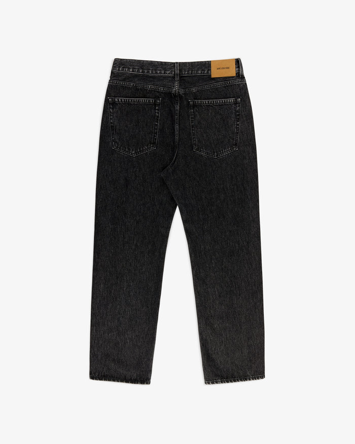 Back view of Relaxed Fit 5-Pocket Denim Pant in black with two back pockets and a tan leather waistband patch.