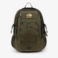 Olive green ALD/The North Face Borealis Backpack with yellow logo, bungee cords, mesh pockets, and brown base on white.