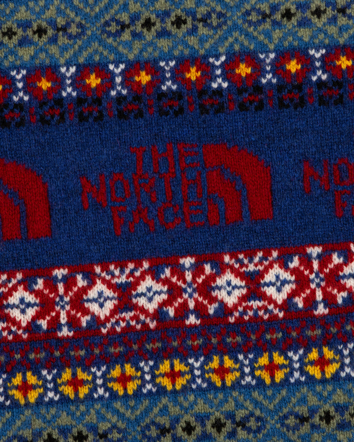 Close-up of the ALD / The North Face Fair Isle Scarf, featuring a colorful pattern and red logo at the center.