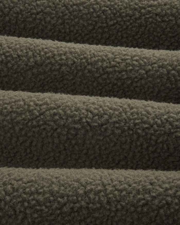 Close-up of ALD/The North Face Fleece Rugby in dark brown, highlighting its soft, textured, and cozy fabric.