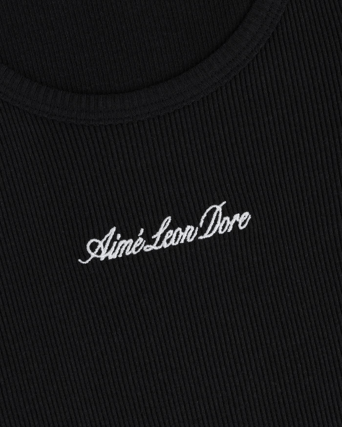Close-up of black ribbed Embroidered Logo Tank Top with Aimé Leon Dore in white cursive text.