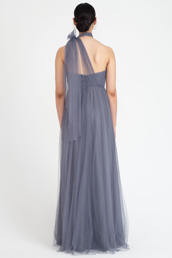 features convertible panels that can be raised and manipulated to create alternate necklines and skirt details