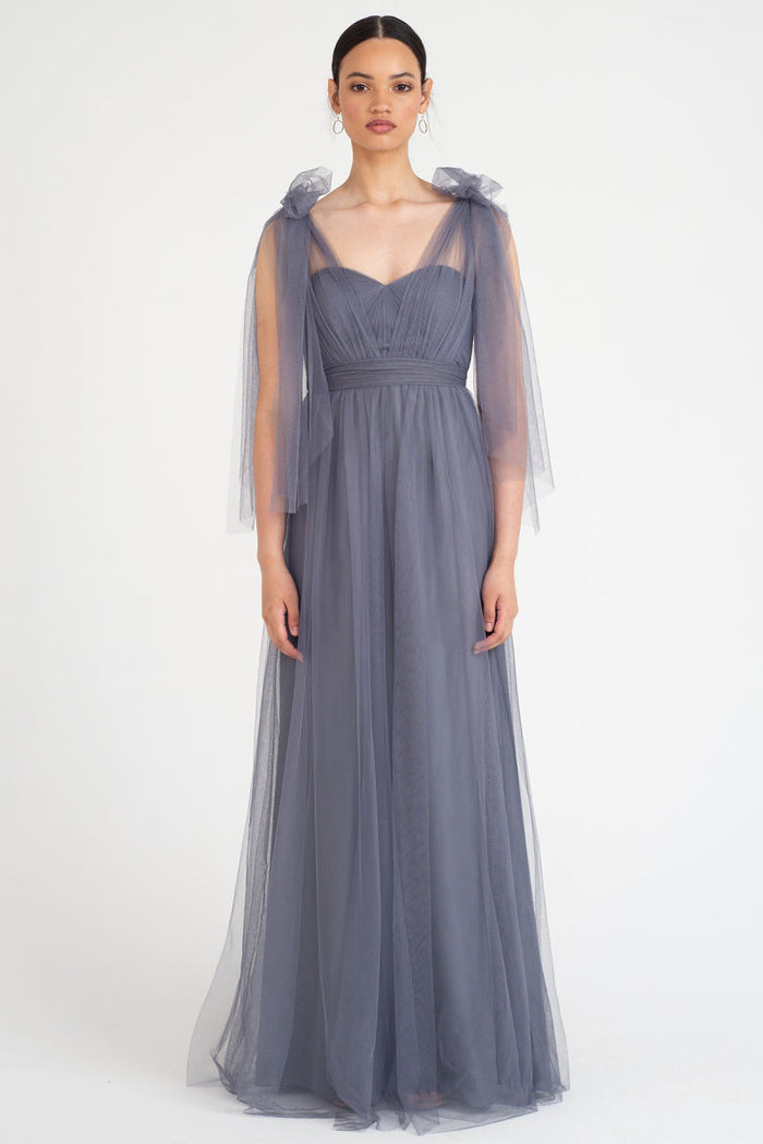 A detachable tulle sash that can be used to tie around the waist to create definition and finish the look is included