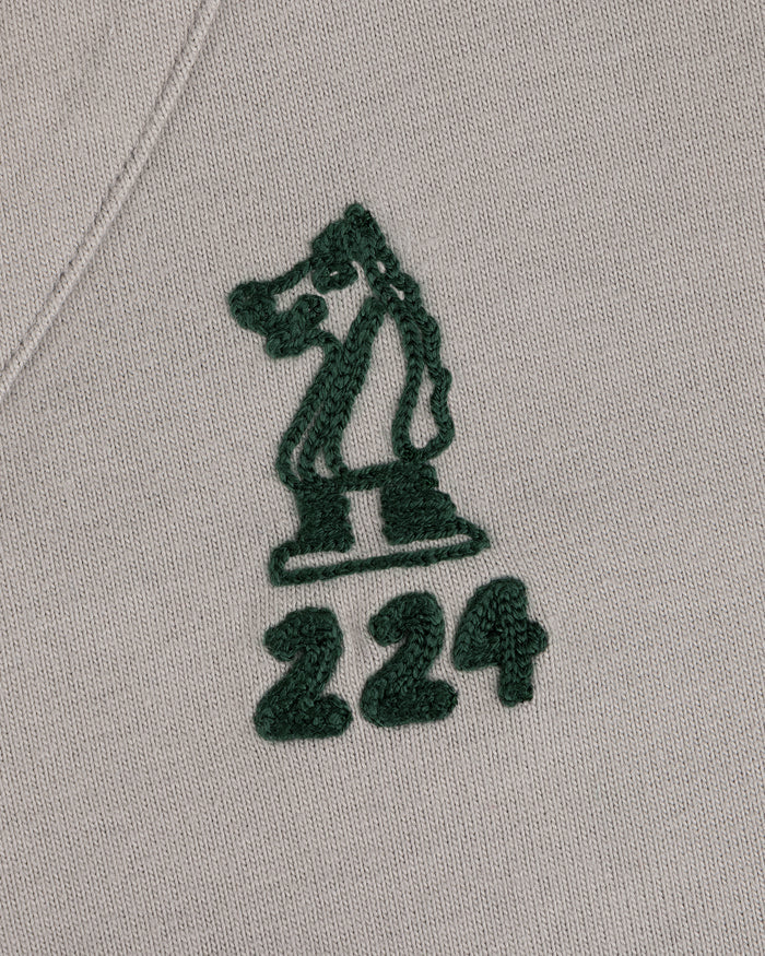 Mulberry Chainstitch Baseball Jersey with a green chess knight and 224 embroidered on light beige fabric.