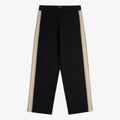 Saint George Track Pant in black with wide legs and beige side stripes, laid flat on a white background.