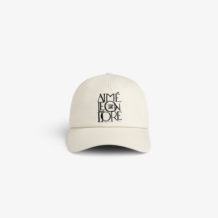 Beige Stacked Logo Hat with AIMÉ LEON DORE text and small crest logo embroidered on the front.