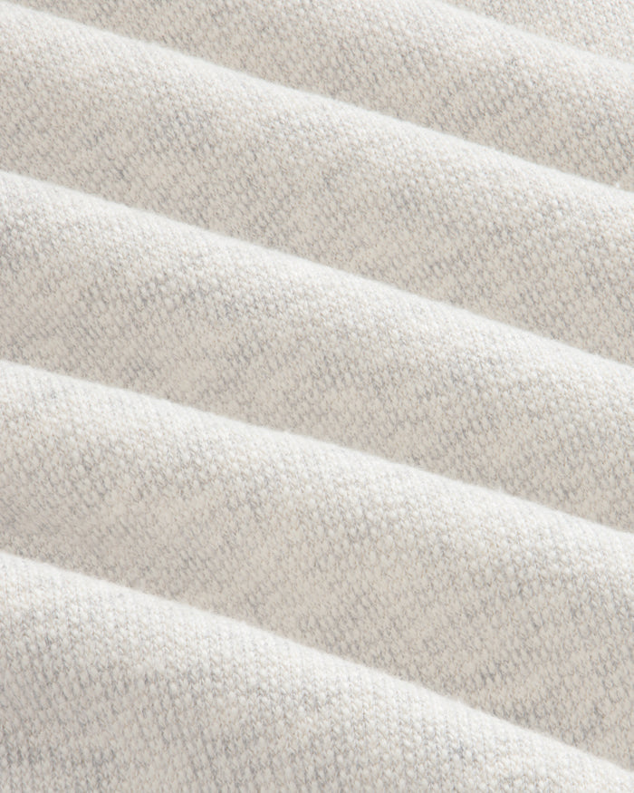 Close-up of the Stone Washed Marina Hoodie’s soft, light gray ribbed fabric with diagonal knitted ridges.