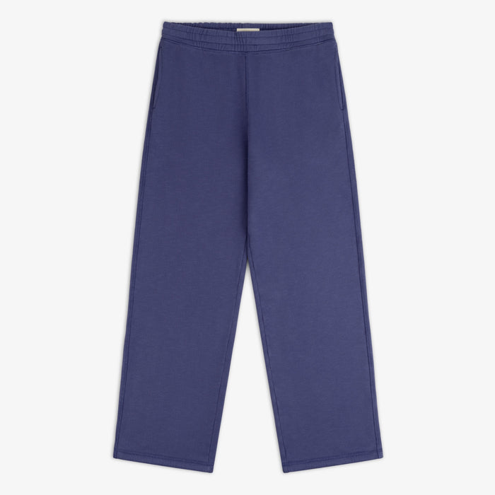 Stone Washed Marina Sweatpants in blue, wide-leg style with elastic waistband and side pockets on white background.
