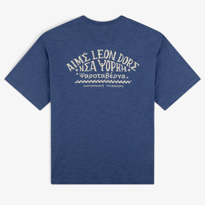 Taverna Tee: Blue short-sleeve t-shirt with white Greek and English text, plus decorative back design.