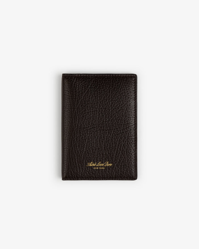 A black Tumbled Leather Passport Holder with gold lettering, shown closed on a plain white background.