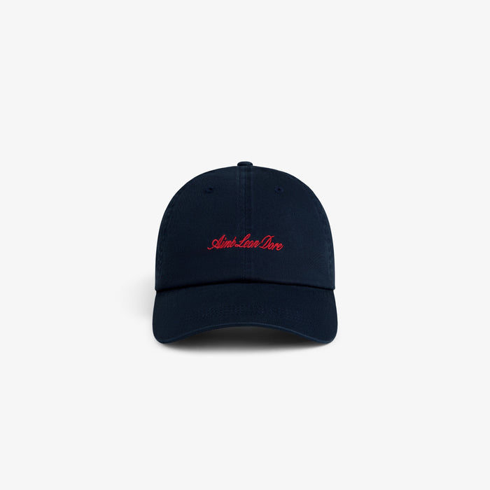 Washed Script Chino Hat in navy with red “Aim. Live. Love.” script on front, shown against a white background.