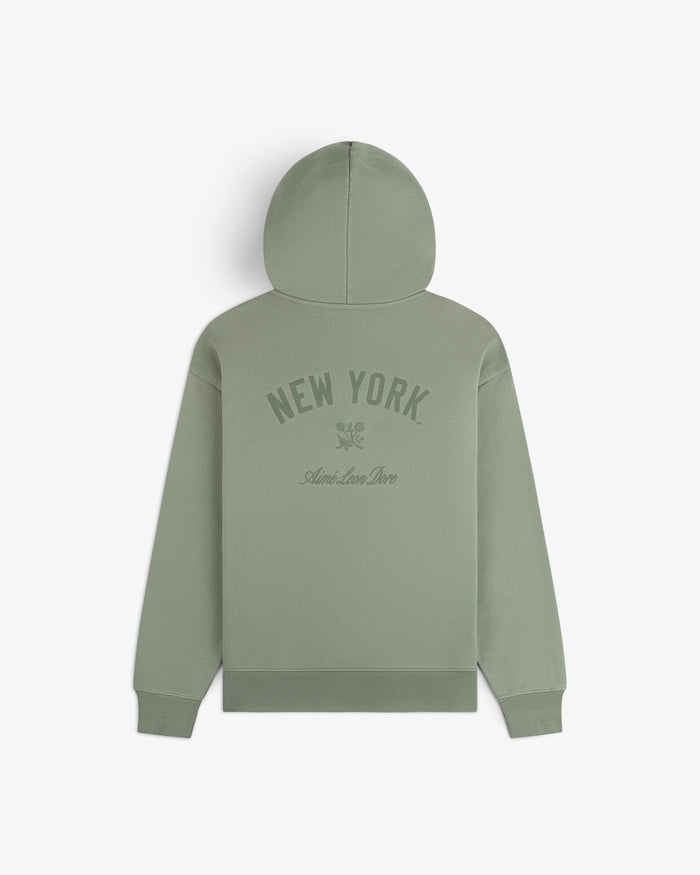 Yankees Washed Full-Zip Hoodie in sage green with NEW YORK and Aimé Leon Dore text, shown on a white background.