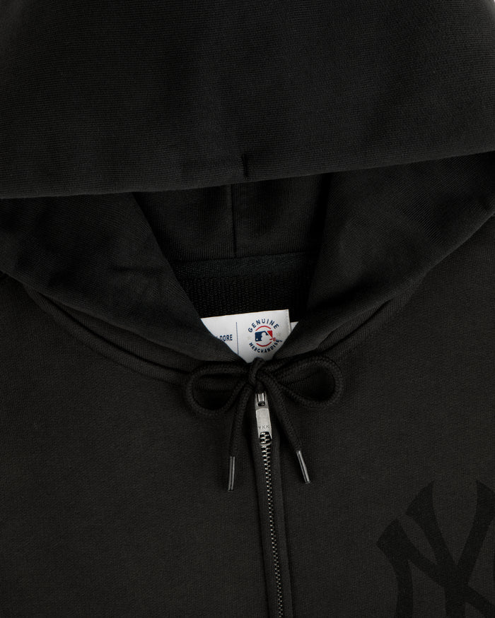 Close-up of a Yankees Washed Full-Zip Hoodie in black, featuring a drawstring and a visible inside collar tag.