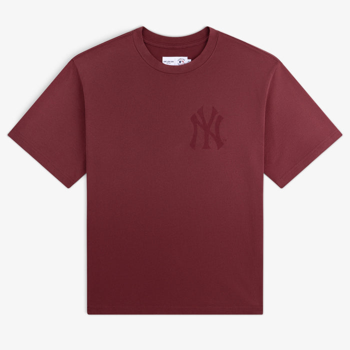 Yankees Washed Logo Tee: Burgundy short-sleeve shirt with a subtle Yankees logo on the left chest.