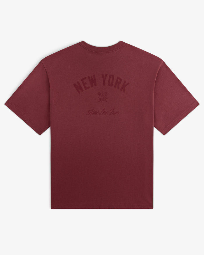 Yankees Washed Logo Tee in maroon with NEW YORK and Aimé Leon Dore text printed in dark red on the back.